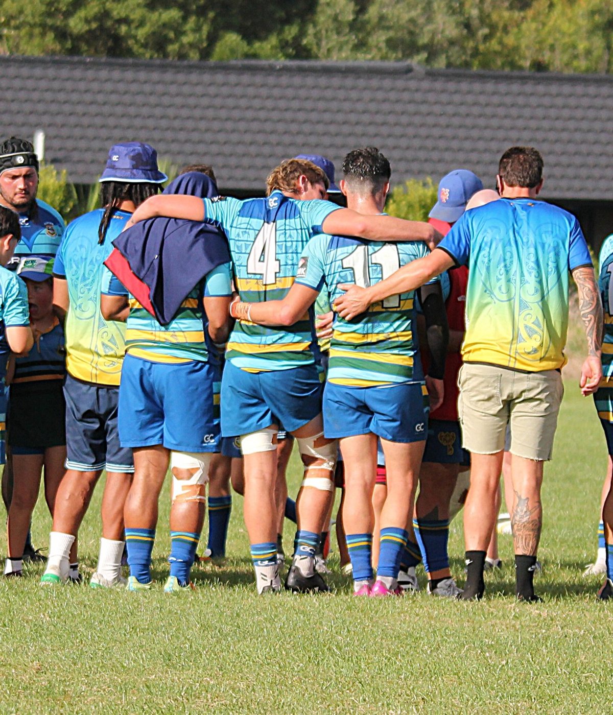 Clifton Rugby team in a pre-match huddle wearing custom Game Changer kit.