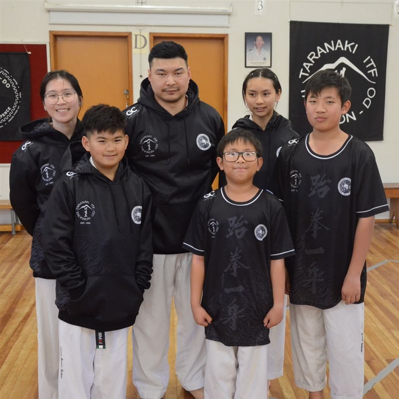A martial arts club in custom Game Changer uniforms.