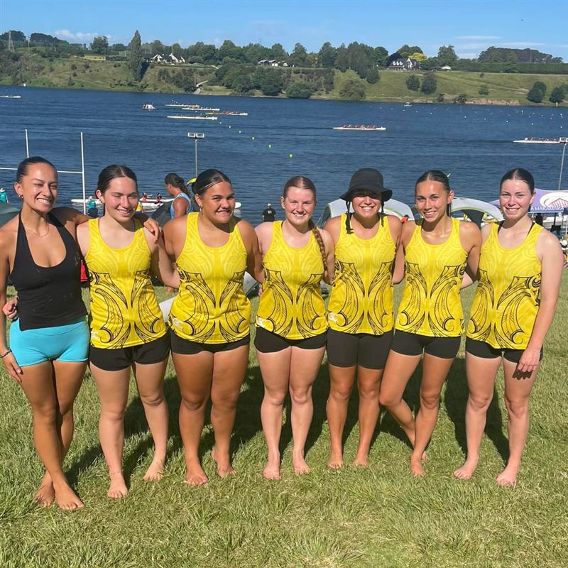 A waka ama team in custom Game Changer singlets.