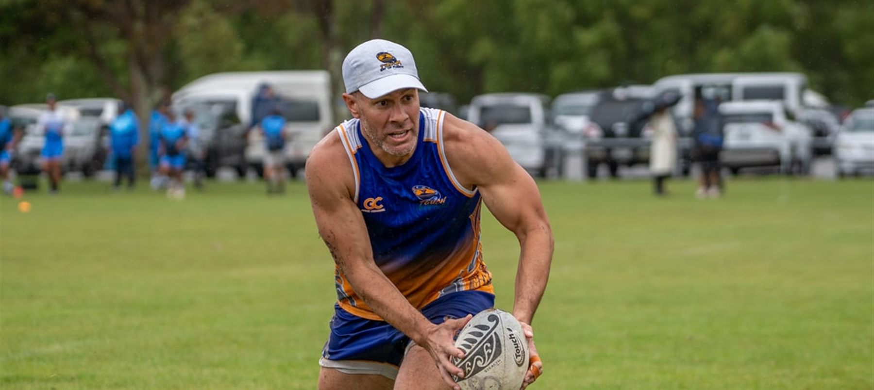 A Game Changer touch player in custom kit, mid-play with the ball.